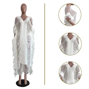 Detailed close-up views of the handmade white knitted hollow out set with fringe tassels