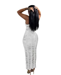 Back view of white knitted hollow-out maxi beach dress with laddered texture detail