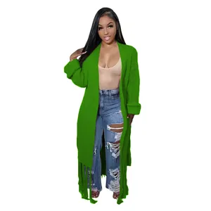 Front full-length view of a vibrant green knit cardigan with stylish long fringe hem detail.