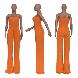 Three-way view of a vibrant orange smocked bodice wide-leg jumpsuit on a mannequin