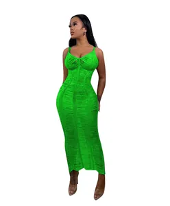 Detail showing the intricate green knitted hollow-out texture of a bodycon beach maxi dress
