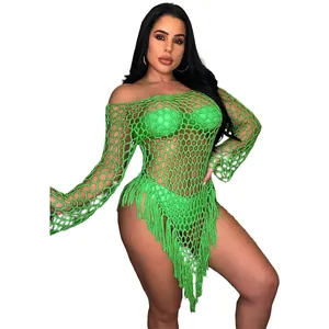 Detail of sexy handmade lime green mesh beach dress with long fringe trim