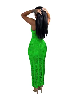 Detailed back view of a vibrant neon green knitted hollow-out maxi beach dress