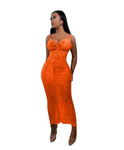 Detailed view of the vibrant orange knit cutout camisole beach maxi dress texture