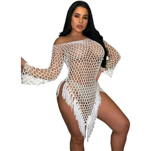 Detailed view of sexy white hand-woven large mesh beach dress with elegant tassel fringe