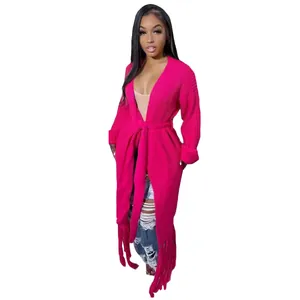 Detailed view of women's fuchsia long knit cardigan with stylish fringe hem