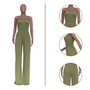 Close-up details of olive green smocked bodice and casual wide-leg jumpsuit fit