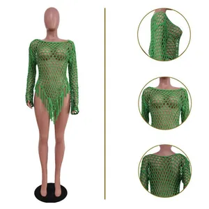Detailed views showing the texture of a sexy green hand-knitted mesh beach dress with tassels