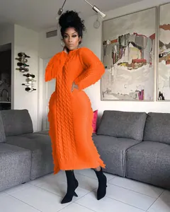 Elegant vibrant orange long cable-knit sweater dress with stylish tassel trim detail