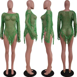 Detail view of green hand-woven mesh beach cover-up dress featuring long fringe