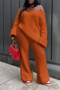 Stylish orange two-piece knit sweater and wide-leg pants set for women in street style