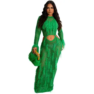 Elegant green crochet knit beach maxi dress with sexy side cutouts and tassel fringe details