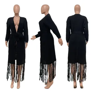 Three-angle view of a long black knit cardigan featuring fringe hem and waist tie