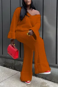 Model wearing a cozy orange two-piece ribbed knit sweater and wide-leg pants set