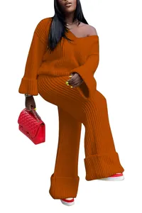 Detailed view of women's burnt orange ribbed knit two-piece set with oversized sweater