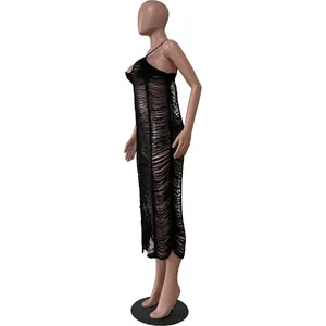 Detailed side view showing the intricate cutout knitting pattern on this black beach dress