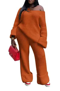 Detail of orange ribbed knit two-piece lounge set with oversized top and wide-leg pants