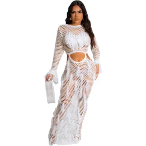 Full-length white crochet hollow-out beach dress featuring tassels and waist cutout