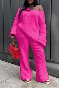 Vibrant hot pink two-piece knitted set with off-shoulder sweater and wide leg pants