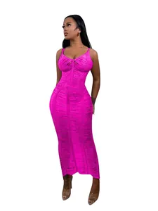 Vibrant fuchsia knit cutout maxi beach dress for women on white background.