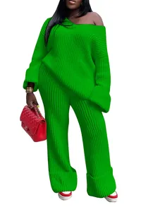 Detail of women's bright green oversized knit sweater and wide-leg pants set