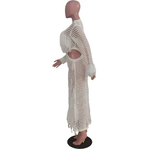 Side view of white crochet knit hollow out beach dress with fringe details and cutouts