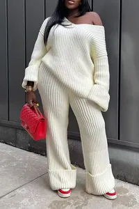 Detail view of cream off-the-shoulder rib-knit sweater and wide-leg lounge pants set
