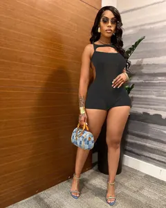 Sleeveless knitted breathable black romper for women shown on a model in a casual setting