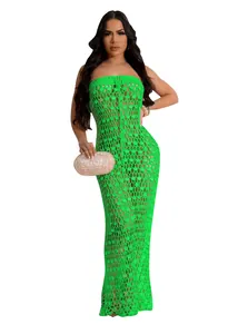 Detailed full-length shot of a vibrant green crochet sequin beach dress worn by a model