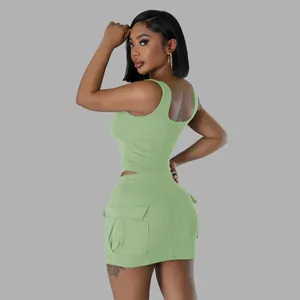 Side view of light green ribbed two-piece set featuring sleeveless top and cargo mini skirt