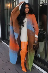 Oversized colorful patchwork knitted long cardigan shown in a stylish outdoor setting
