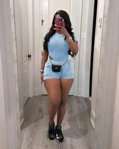 Full-body mirror selfie of a women's casual light blue ribbed bodysuit and shorts set