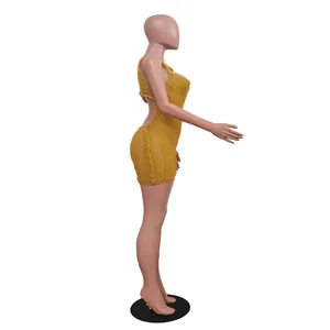 Detailed side view of a yellow sleeveless crochet knit mesh romper for women on a mannequin