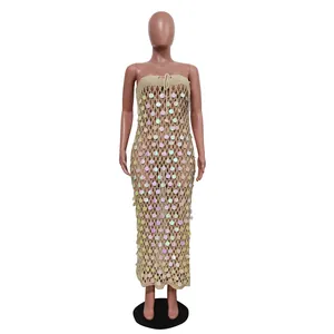 Detailed view of crochet beach dress with iridescent sequins and strapless design
