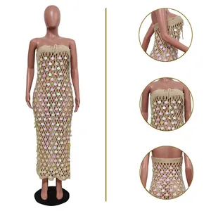 Detail view showing the iridescent sequins and intricate hollow crochet knit on this beach dress.