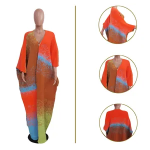 Detail view of a vibrant oversized knitted long cardigan with colorful gradient patterns