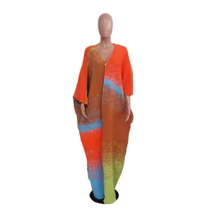 Full-length view of a colorful oversized knitted cardigan with abstract color block patterns.
