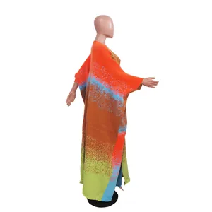Detailed side view of a colorful loose bohemian striped knitted long coat for women