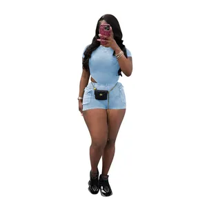 Detail of women's light blue ribbed two-piece set featuring side cutout top and shorts