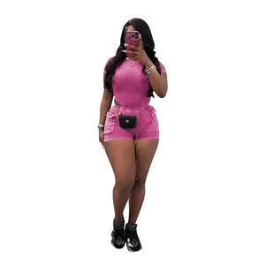 Pink ribbed two-piece shorts set featuring a short-sleeve bodysuit and matching shorts