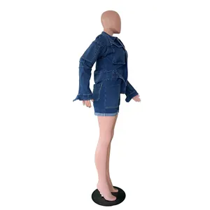 Side profile detail view of a women's dark blue long-sleeve washed denim romper