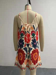 Close-up view of the back lace-up on a loose summer floral jumpsuit with boho style