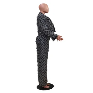 Side view of women's distressed checkerboard jacquard denim jacket and trousers set