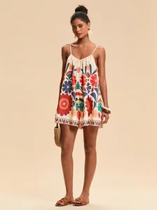Full-length view of a vibrant floral embroidered summer resort style camisole romper
