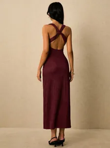 Back view of burgundy knit midi dress featuring elegant open back and criss-cross straps