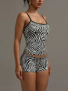 Detailed view of a sexy women's two-piece zebra print camisole and shorts loungewear set.