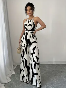 Stylish black and white milk print halter jumpsuit with wide-leg pants for women