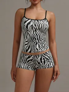 Zebra print two-piece loungewear set featuring camisole top and matching shorts