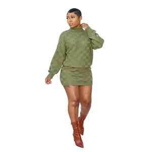 Detail of olive green checkered knit sweater and skirt set on model
