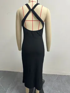 Back view of black ribbed bodycon maxi dress with cross-back halter design on a mannequin